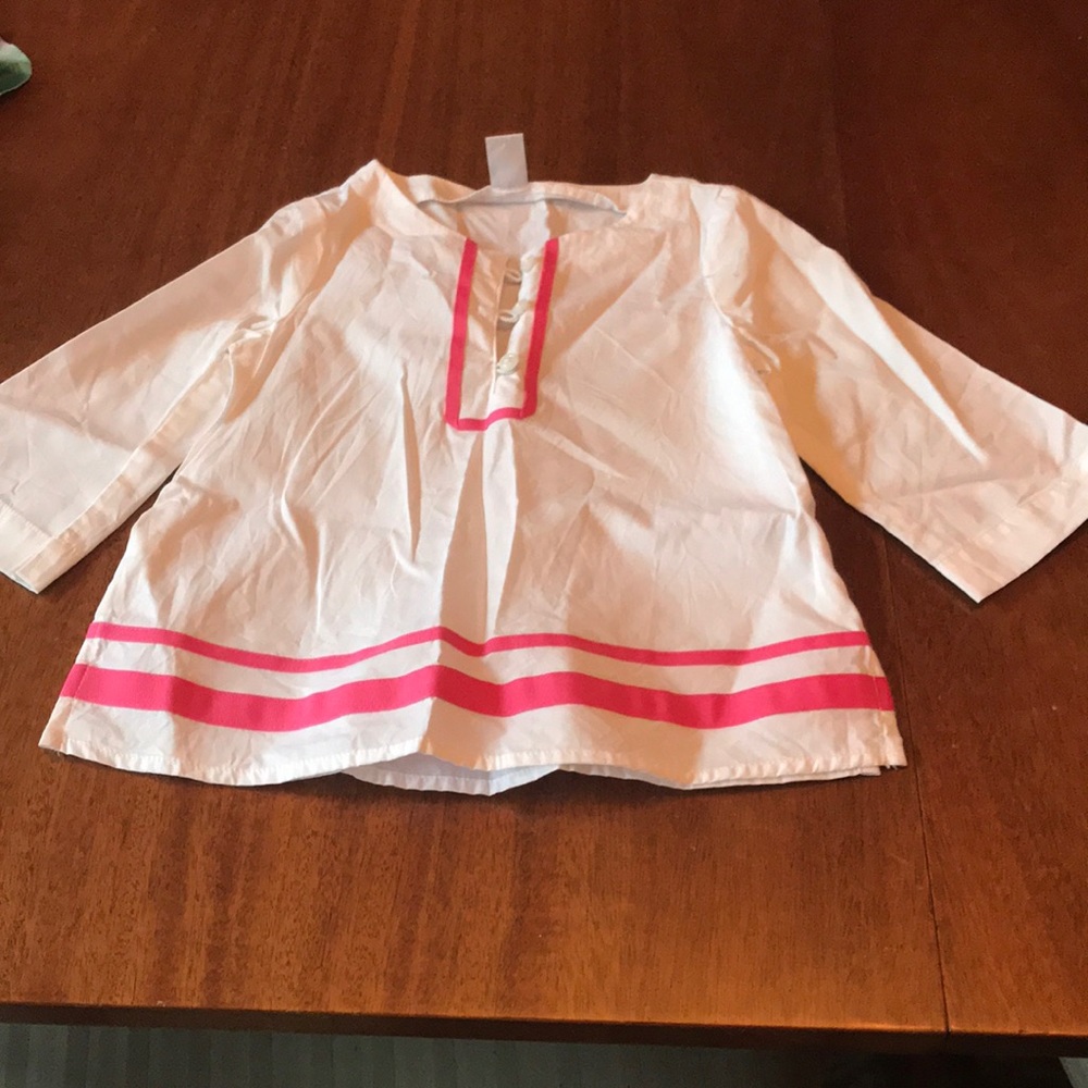 Child’s white and pink long sleeved shirt